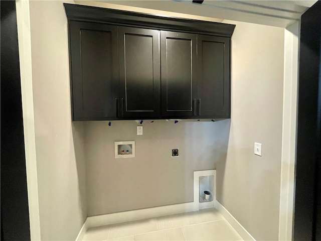 laundry area with electric dryer hookup, light tile patterned floors, cabinets, and washer hookup