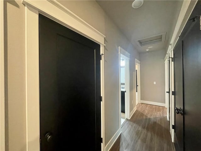 hallway with dark wood-type flooring