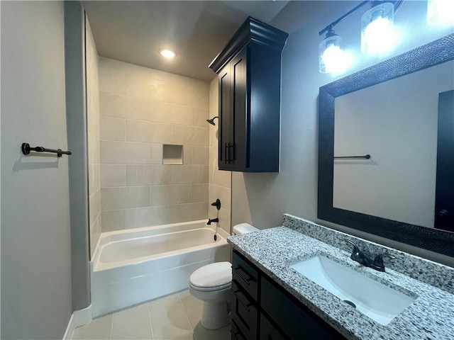 full bathroom featuring tile patterned floors, vanity, toilet, and tiled shower / bath