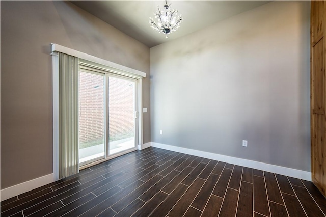 empty room featuring a chandelier