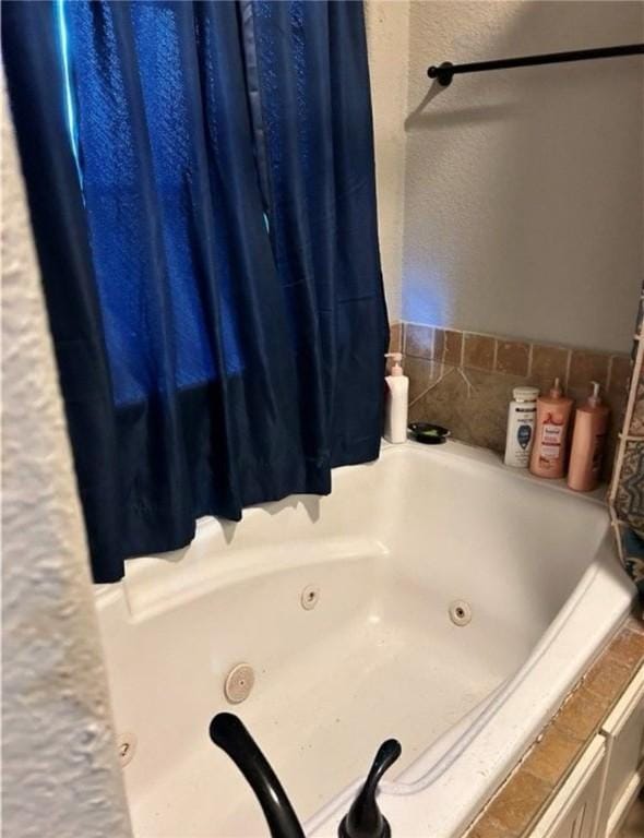 bathroom with a tub