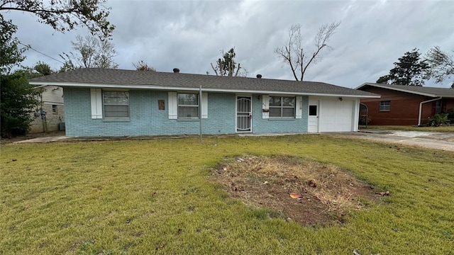 ranch-style house with a garage and a front yard