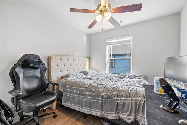 bedroom featuring hardwood / wood-style flooring and ceiling fan