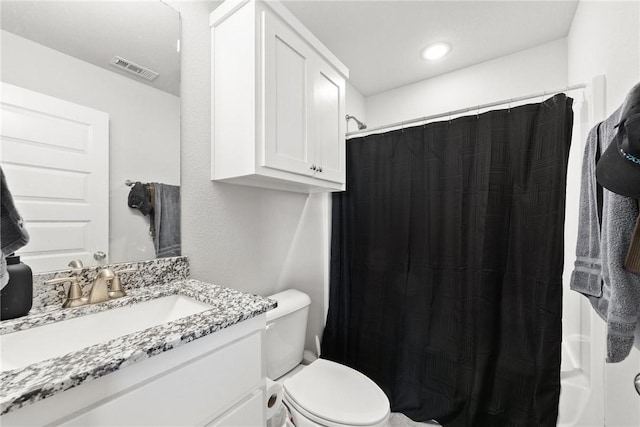 full bathroom featuring vanity, toilet, and shower / tub combo with curtain