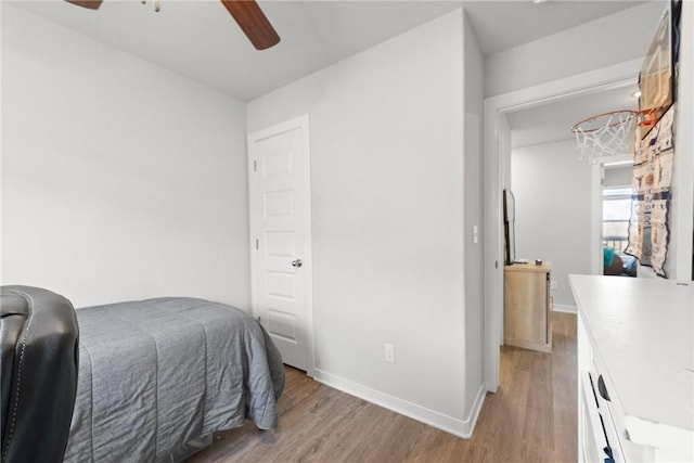 bedroom featuring ceiling fan and light hardwood / wood-style floors