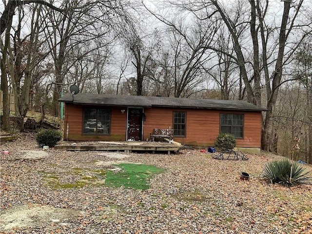 view of front of property with a wooden deck