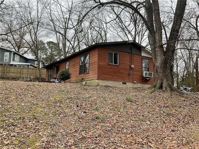 view of side of property featuring cooling unit