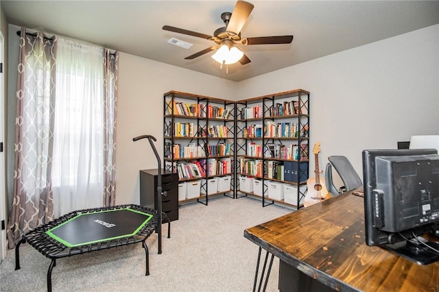 office space featuring carpet and ceiling fan