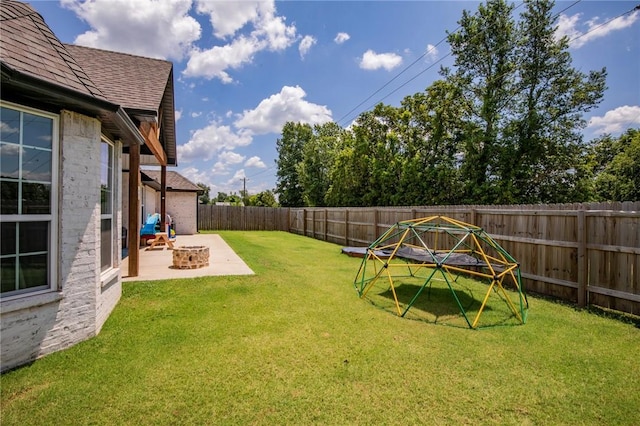 view of yard featuring a patio area and an outdoor fire pit