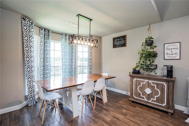 dining area with dark hardwood / wood-style flooring