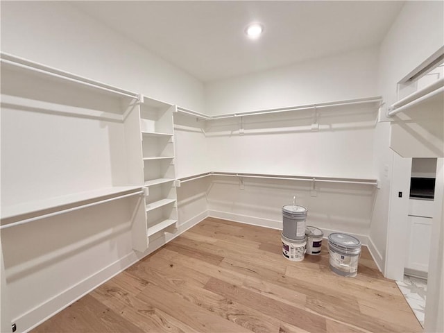 walk in closet featuring light wood-type flooring