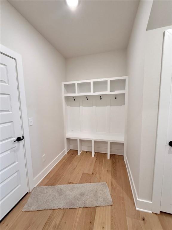mudroom with light wood-style floors and baseboards