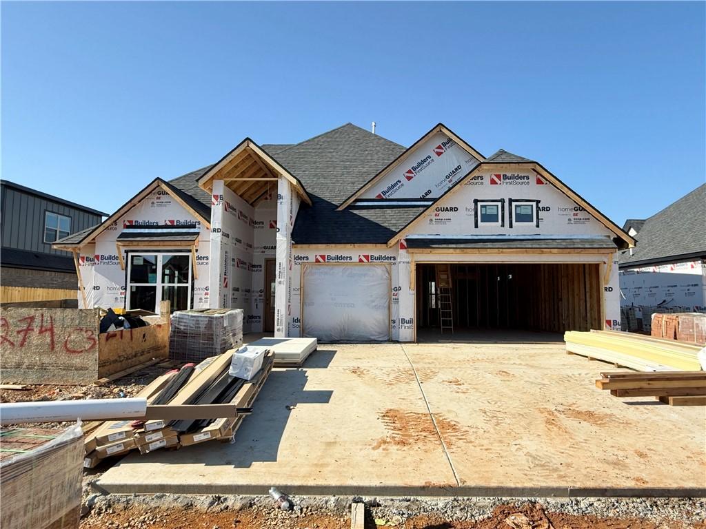 unfinished property featuring a garage