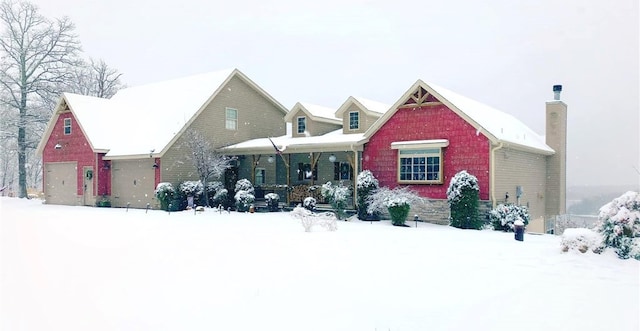 view of front of house featuring a porch and a garage