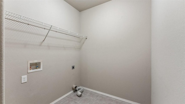 laundry room featuring light tile patterned floors, washer hookup, and hookup for an electric dryer