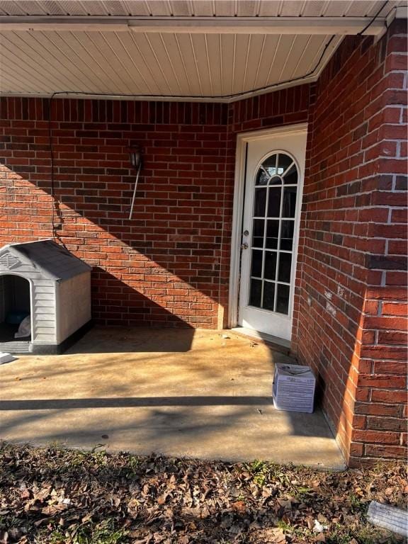 entrance to property with a patio