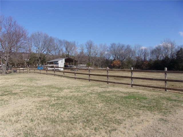 view of yard with a rural view