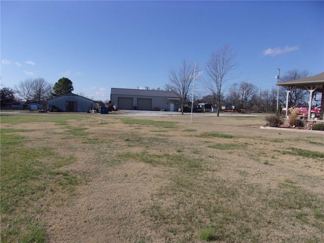 view of yard featuring a garage