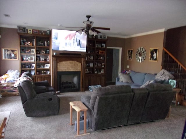 living room with ceiling fan, ornamental molding, and carpet floors