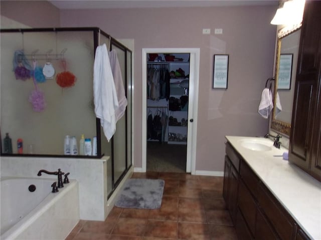 bathroom with vanity, tile patterned floors, and shower with separate bathtub