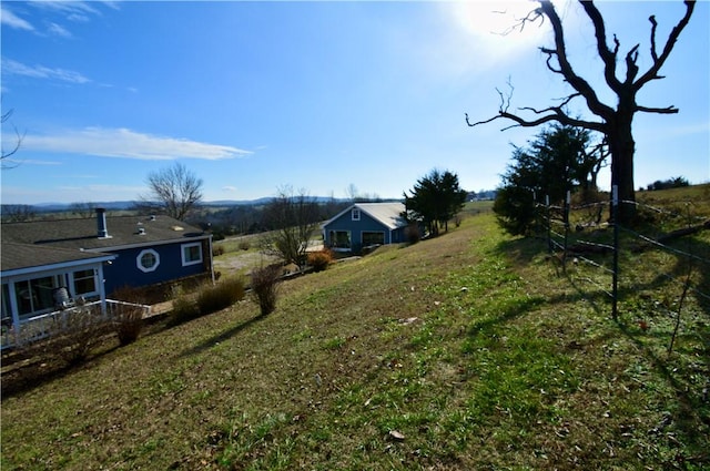 view of yard with a rural view