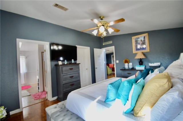 bedroom featuring hardwood / wood-style flooring and ceiling fan