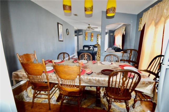 dining space featuring ceiling fan