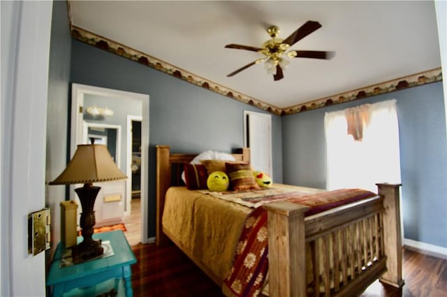 bedroom featuring ceiling fan and dark hardwood / wood-style flooring