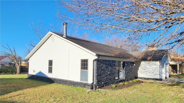 view of property exterior featuring a lawn