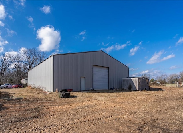 view of outdoor structure with a garage