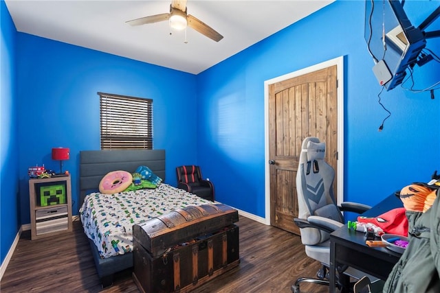 bedroom featuring ceiling fan and dark wood-type flooring