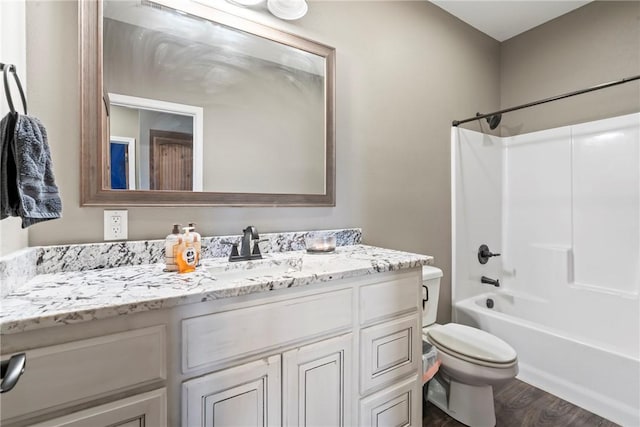 full bathroom featuring shower / tub combination, toilet, vanity, and hardwood / wood-style flooring