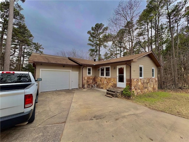 single story home featuring a garage