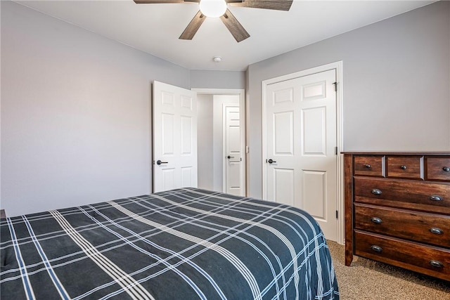 carpeted bedroom featuring ceiling fan