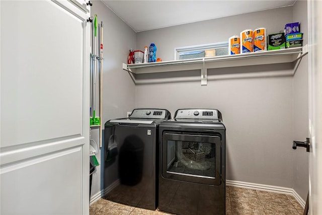 clothes washing area featuring washing machine and dryer