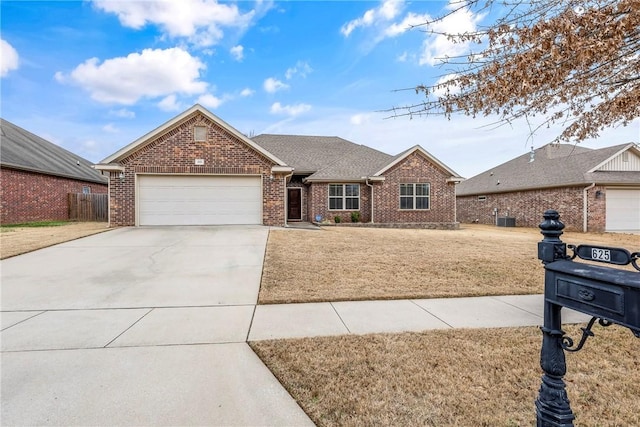 view of front of house featuring a garage and a front lawn