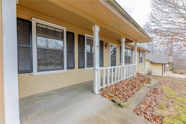 view of exterior entry featuring a porch