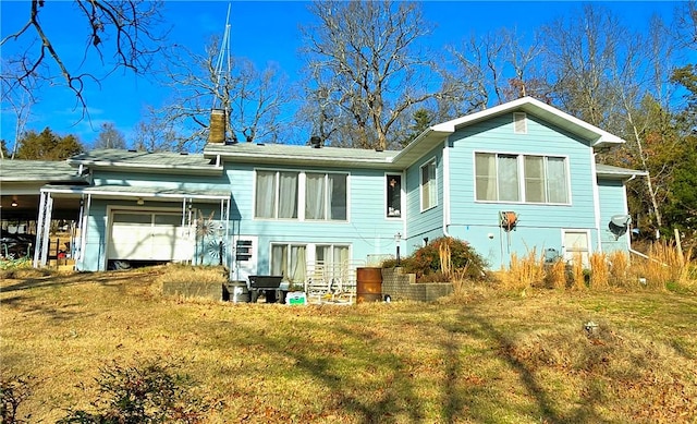 rear view of house with a lawn