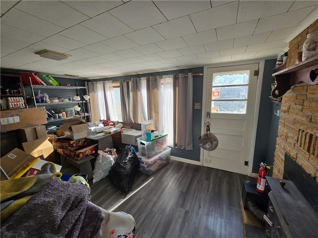 interior space featuring a fireplace and dark wood-type flooring