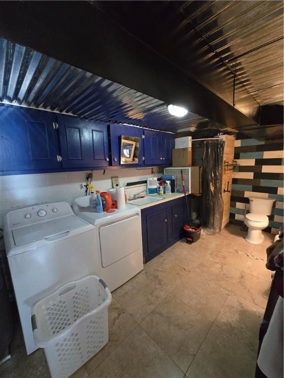 laundry room featuring washing machine and dryer and sink