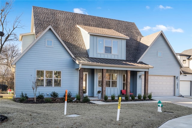 view of front of house featuring covered porch and a garage