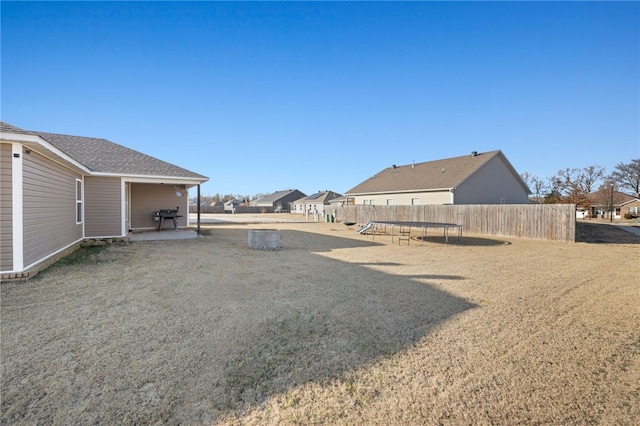 view of yard featuring a playground, a patio, and a trampoline