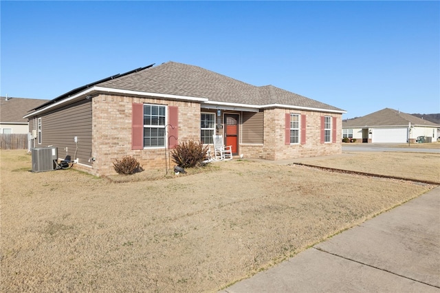 single story home featuring central air condition unit