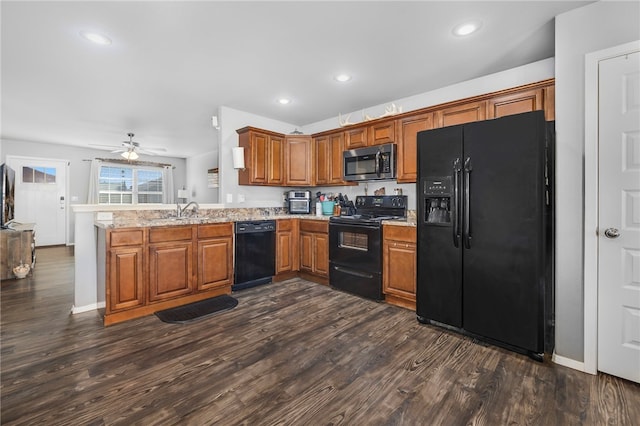 kitchen featuring black appliances, ceiling fan, kitchen peninsula, and dark wood-type flooring