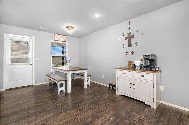 dining room featuring dark wood-type flooring