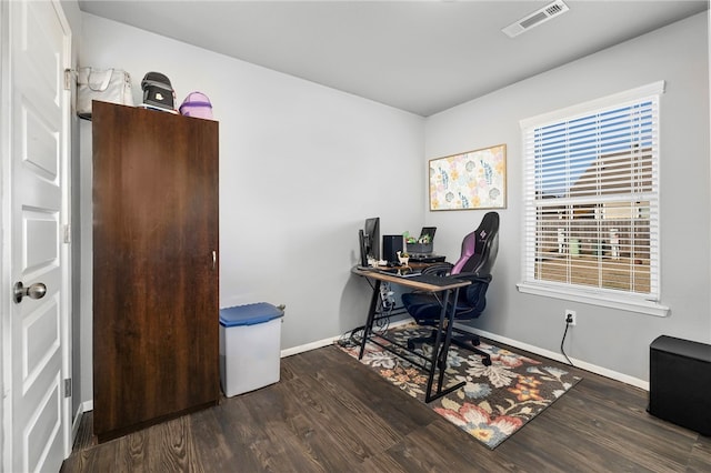 office space with dark wood-type flooring