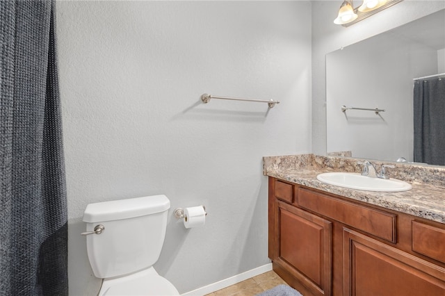 bathroom featuring tile patterned flooring, vanity, toilet, and a shower with curtain