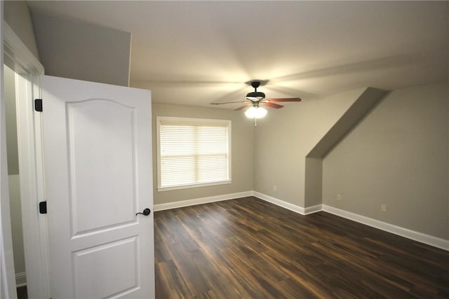 bonus room with dark hardwood / wood-style flooring and ceiling fan