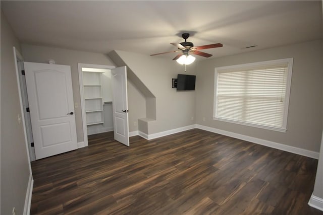 additional living space featuring ceiling fan and dark wood-type flooring