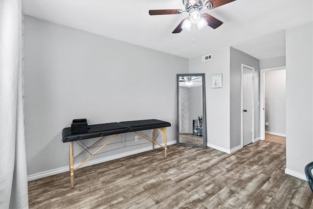 miscellaneous room with ceiling fan and hardwood / wood-style flooring